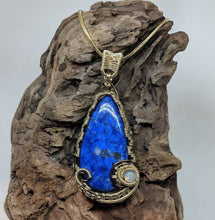 Load image into Gallery viewer, Handmade Wirewrapped Lapis and Welo Opal Pendant
